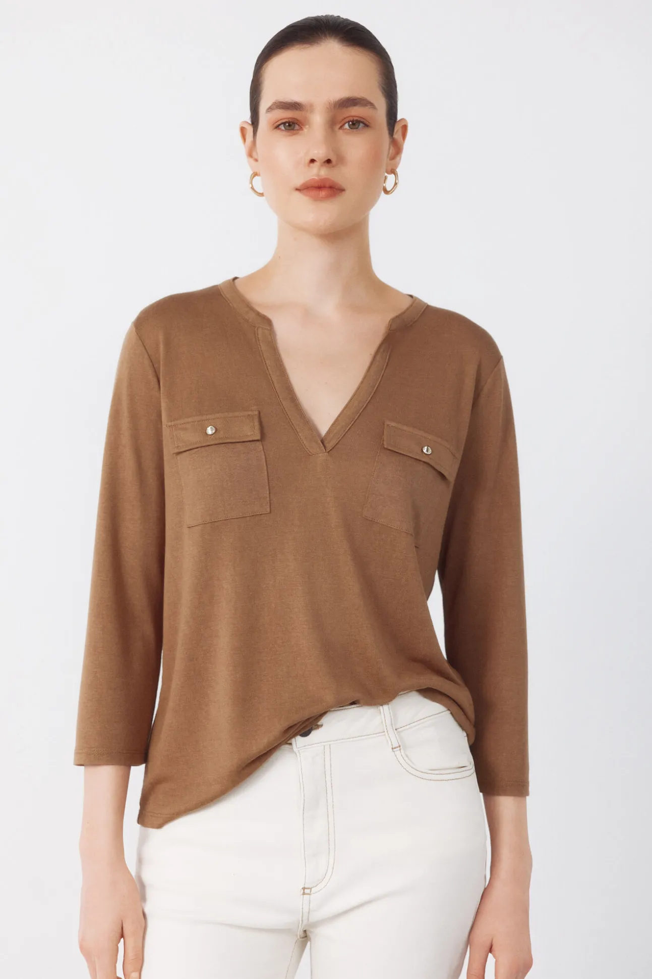 Camiseta com bolsos