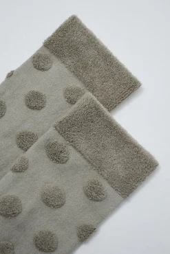 Meias compridas com texturas de bolinhas verde